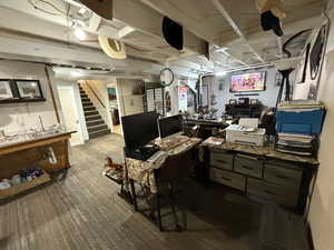 Office area with dark wood finished floors