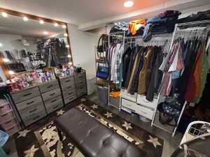 Walk in closet featuring wood finished floors