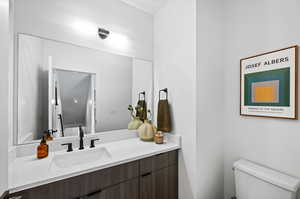 Powder Bathrooms featuring Custom Vanity and Modern Light Fixtures