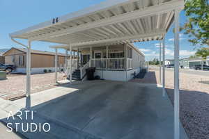 Covered porch with an attached carport