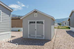View of shed with a mountain view