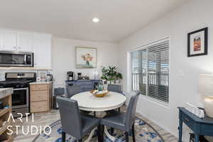 Dining room featuring light wood-style flooring and recessed lighting