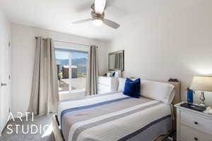 Bedroom with carpet floors and a ceiling fan