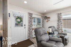 Entryway featuring wood finished floors and recessed lighting