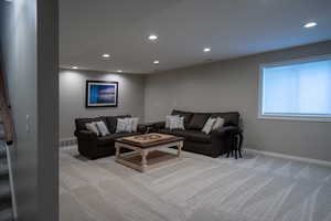 Single story home with stucco siding, roof with shingles, a garage, and driveway