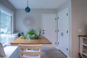 Dining room with wood finished floors and baseboards