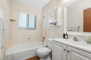 Full bathroom with shower / tub combination, vanity, and tile patterned floors *Virtually Staged*