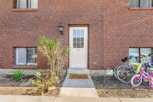 Property entrance with brick siding