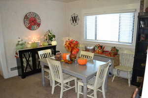 View of carpeted dining space