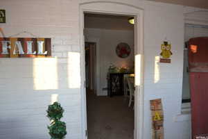 Hall with brick wall and carpet floors