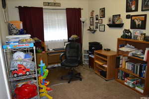 Home office featuring light carpet