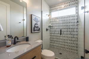 Bathroom with vanity and a stall shower