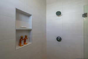 Full bathroom with a tile shower