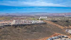Aerial view of residential area featuring a mountainous background
