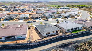 Aerial perspective of suburban area featuring a mountain backdrop