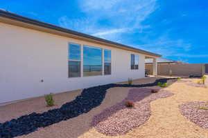 View of side of home featuring a patio and stucco siding