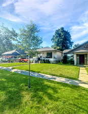 View of front of property with a front yard