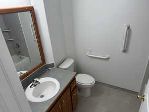Full bathroom featuring vanity, tile patterned flooring, and bathing tub / shower combination