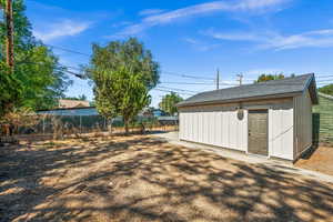 View of yard with an outbuilding