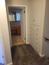 Upper Landing looking at built-in cabinets andbathroom