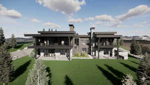 Rear view of house featuring a patio area, a yard, a balcony, and a chimney