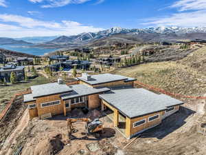 Aerial perspective of suburban area featuring a mountain backdrop