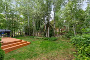 View of yard featuring a deck