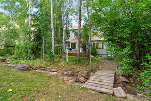 View of yard with a wooden deck