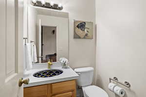 Half bath with vanity and toilet