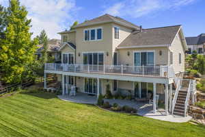 Back of home, walk out to main level decking or lower level patio