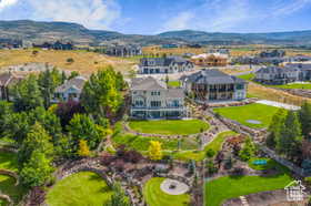 Aerial perspective of suburban area with a mountainous background