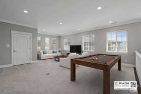 Playroom featuring billiards table, ornamental molding, recessed lighting, and carpet flooring