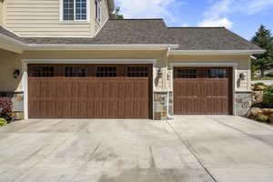Garage featuring concrete driveway