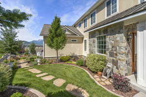 View of left side yard  walkway with mountain view
