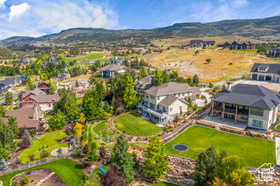 Aerial view of residential area featuring a mountain backdrop