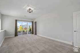 Unfurnished room with light carpet