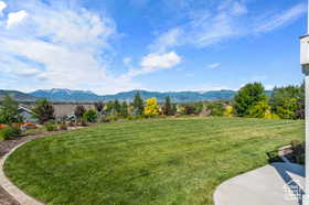 View of green lawn with a mountain view