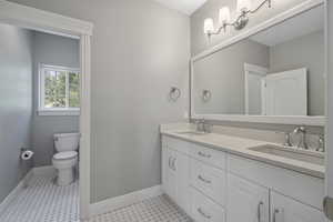 Upstairs bathroom for 2 bedrooms and game room, separate toilet  shower area, double vanity