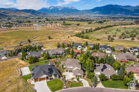 Aerial view of residential area featuring a mountainous background