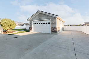 Garage featuring driveway and a mountain view