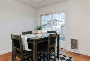 Dining space featuring baseboards and light wood-type flooring