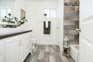 Bathroom with vanity and light wood-style floors