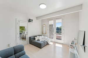 Bedroom # 4 on the main level.  Has private balcony and connected to 3/4 bathroom off the pool area!