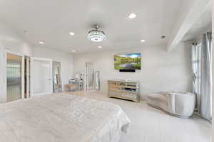 Primary bedroom with sitting area and plenty of space