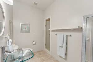 Bathroom with shower off the swimming pool area