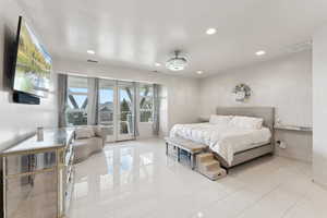 Primary bedroom with private balcony and heated Bamboo floors!