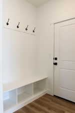Mudroom with dark wood finished floors