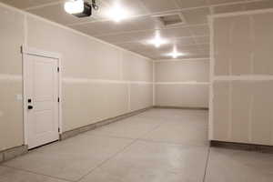 Garage featuring a garage door opener