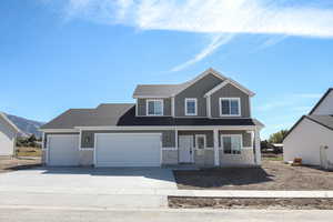Craftsman-style house with covered porch, a garage, concrete driveway, roof with shingles, and stone siding