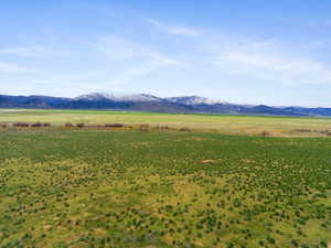 View of mountain backdrop with rural landscape